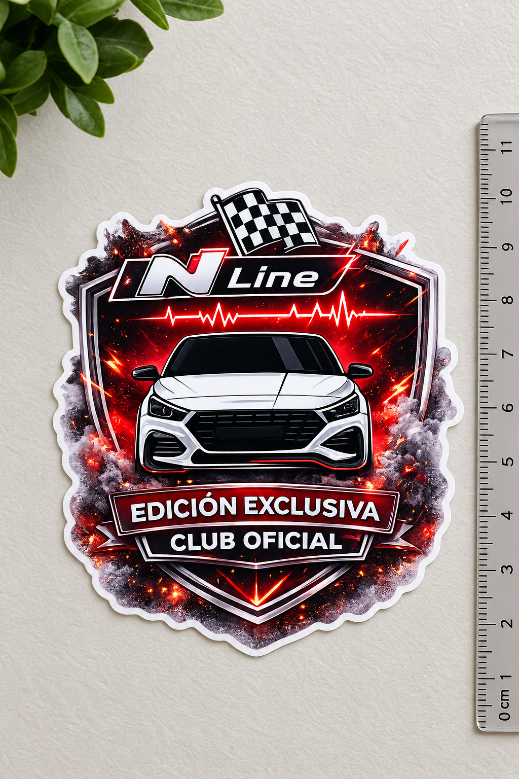 Pegatina Edición Exclusiva — Club Oficial N Line con el frontal de un deportivo blanco entre llamas y humo